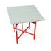 Table with a white top and red metal frame on a white background