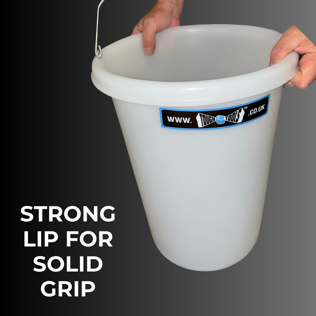 White bucket with a handle held by hands on a dark background, featuring a label.