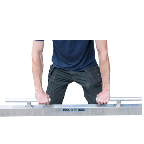 Person holding a metal tool with handles on a white background