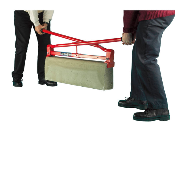 Two people using a red hand tool to move a kerbstone