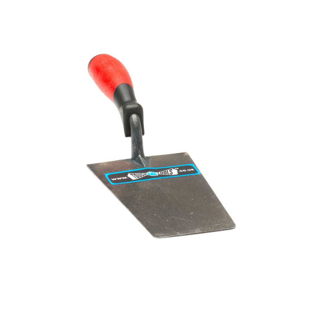 Metal building trowel with red handle used in building works.