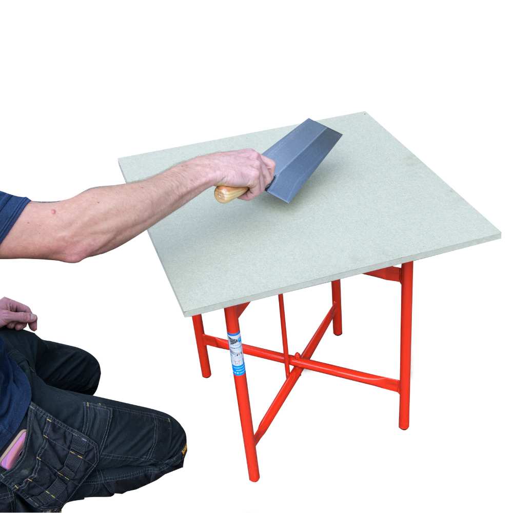 red metal stand and white plastic top board. With man holding a trowel to show how the boards are used for low level plastering and building