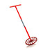 Red metal mixing wheel with long handle used for mixing plaster.