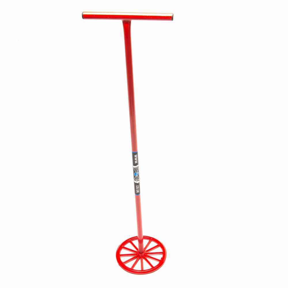 Red metal mixing wheel with long handle used for mixing plaster.