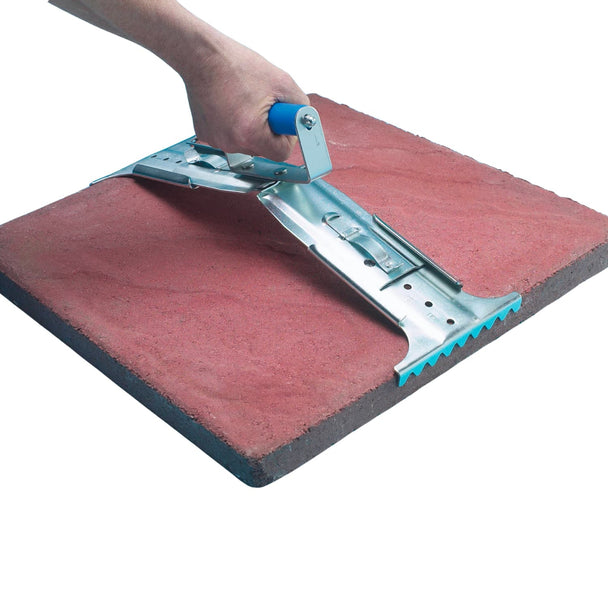 Hand using a trowel on a red paving slab with a white background