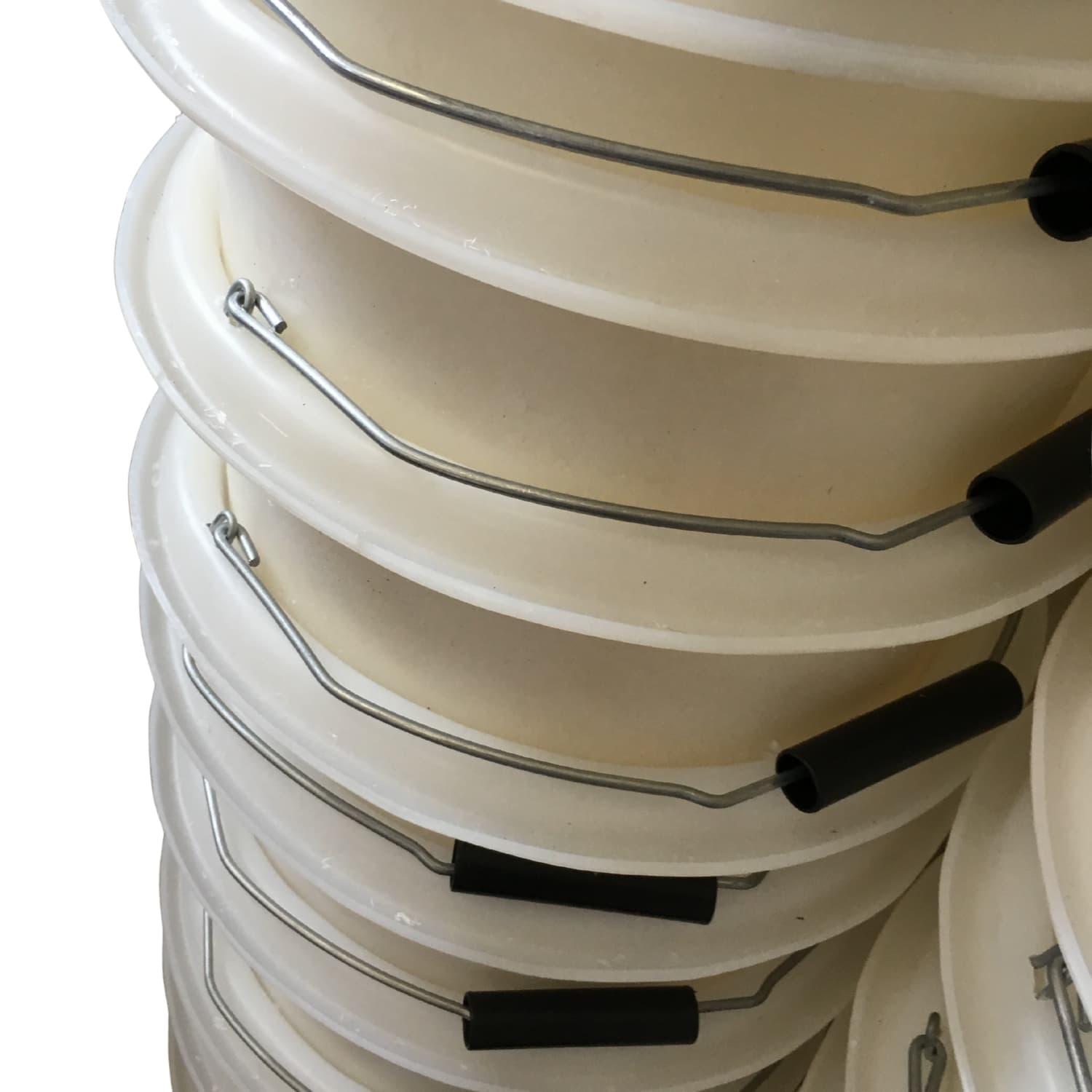 Stack of white buckets with black handles on a white background