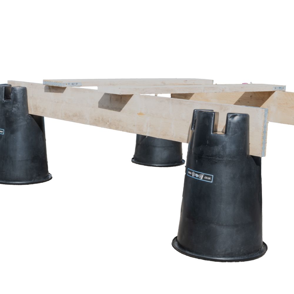 Black lo dek buckets upside down with scaffold planks on top